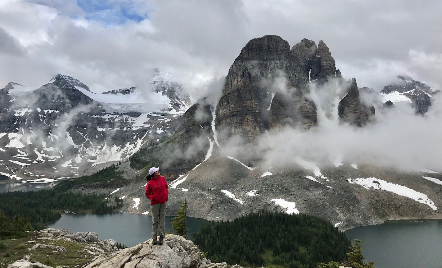 Woman in Red Jacket looking at the mountains